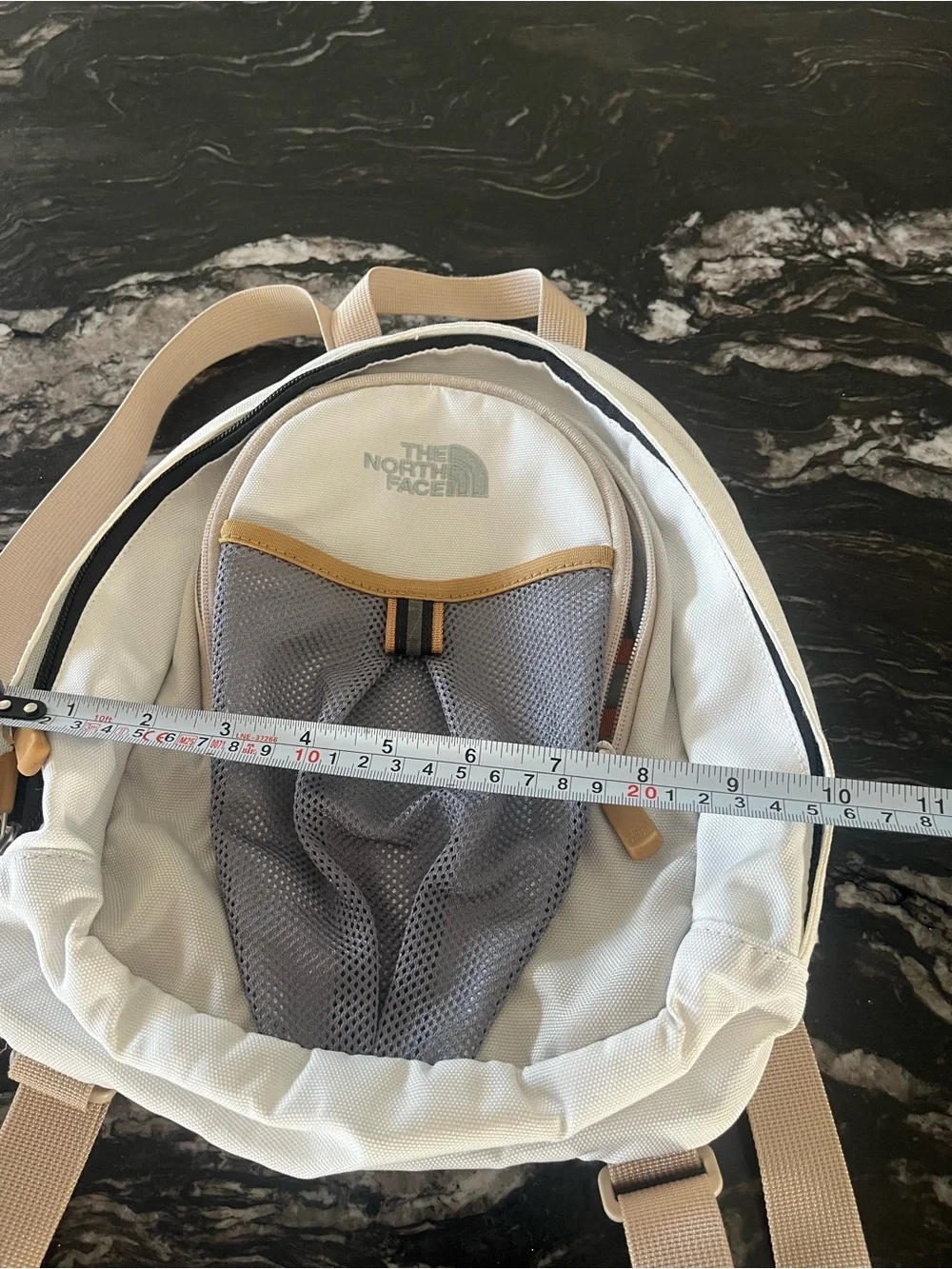 The North Face Cream and Gray Mini Backpack with Tan Accents